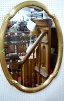 Lot 1098 - A modern reeded gilt framed oval wall mirror...