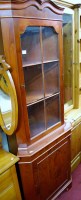 Lot 1105 - A reproduction yew wood freestanding corner...