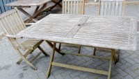 Lot 1127 - A contemporary stained slatted teak garden...
