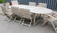 Lot 1130 - A contemporary slatted teak garden suite by...