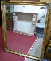 Lot 1138 - A modern gilt framed bevelled rectangular wall...