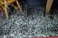 Lot 1155 - A modern synthetic deep pile rug in shades of...