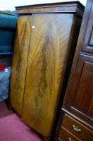 Lot 1164 - A reproduction mahogany double door wardrobe