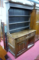 Lot 1180 - An antique joined oak dresser, having three...
