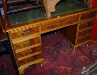 Lot 1227 - A reproduction yew wood and gilt tooled green...