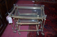 Lot 1228 - A metal and glass topped nest of three...