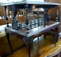 Lot 1234 - An Edwardian walnut two-tier book table raised...