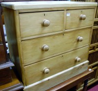 Lot 1238 - A pine square front chest of two short over...
