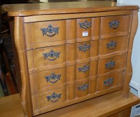 Lot 1242 - An oak four drawer bombe chest, width 71cm
