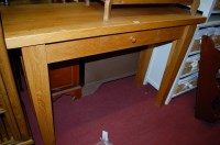 Lot 1243 - A contemporary light oak single drawer side...
