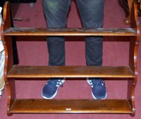 Lot 1244 - A 19th century mahogany three-tier hanging...