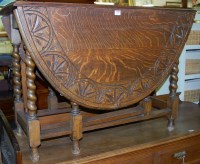 Lot 1250 - An early 20th century line carved oak barley...