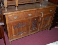 Lot 1251 - An early 20th century low relief carved oak...