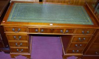 Lot 1253 - A reproduction yew wood and gilt tooled green...