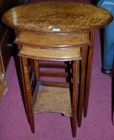 Lot 1256 - An early 20th century oak oval nest of three...