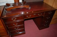 Lot 1258 - A reproduction mahogany and gilt tooled...