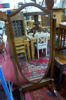 Lot 1270 - A Regency style mahogany shield shaped cheval...