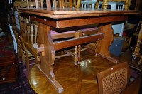 Lot 1275 - An oak trestle end drawleaf dining table;...