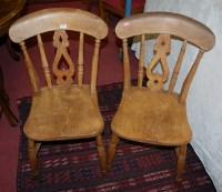 Lot 1277 - A set of four early 20th century elm splatback...