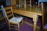 Lot 1279 - A contemporary elm refectory table, raised on...