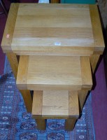 Lot 1290 - A contemporary joined blond oak nest of three...