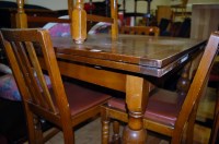 Lot 1293 - A moulded oak drawleaf dining table; together...