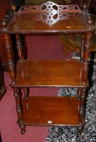 Lot 1299 - A late Victorian walnut three-tier whatnot,...