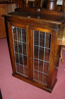 Lot 1312 - A 1930s oak ledgeback double door lead glazed...