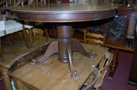 Lot 1314 - An early 20th century oak extending dining...