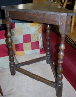Lot 1318 - An antique joined oak corner table