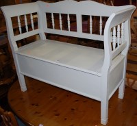 Lot 1329 - A lime green painted pine double hinged settle,...