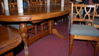 Lot 1330 - A modern pine dining suite, comprising...