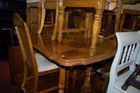 Lot 1331 - A contemporary Belgian walnut dining suite,...