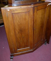 Lot 1335 - A hardwood double door low corner cupboard