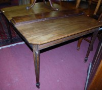 Lot 1336 - An Edwardian mahogany extending dining table,...