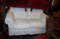 Lot 1341 - A modern cream floral upholstered two-seater sofa