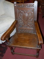 Lot 1342 - An Arts & Crafts low relief carved oak...