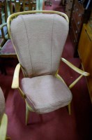 Lot 1362 - An Ercol blond elm stickback armchair;...