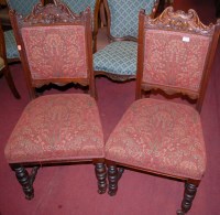 Lot 1370 - A set of six Edwardian carved walnut and red...