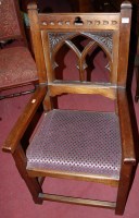 Lot 1371 - A Gothic Revival joined hardwood open elbow chair