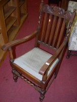 Lot 1372 - A 1930s barleytwist oak slatback open elbow chair
