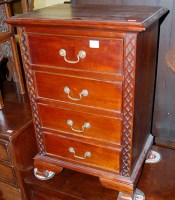 Lot 1387 - A contemporary hardwood four drawer bedside chest