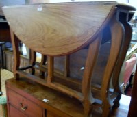 Lot 1396 - A low hardwood drop flap occasional table...