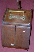 Lot 1398 - An Edwardian walnut coal purdonium with shovel