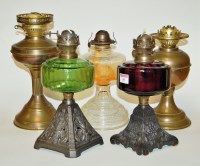 Lot 10 - A late Victorian oil lamp having amber glass...