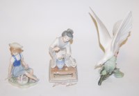 Lot 16 - A large Lladro figure of a dove perched on a...