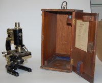 Lot 25 - An early 20th century brass and iron monocular...