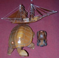 Lot 80 - A large carved hardwood figure of a turtle;...