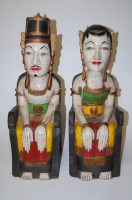 Lot 119 - A pair of large carved hardwood and polychrome...