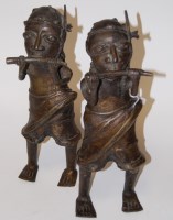 Lot 123 - A pair of Benin(?) bronze figures, each in the...